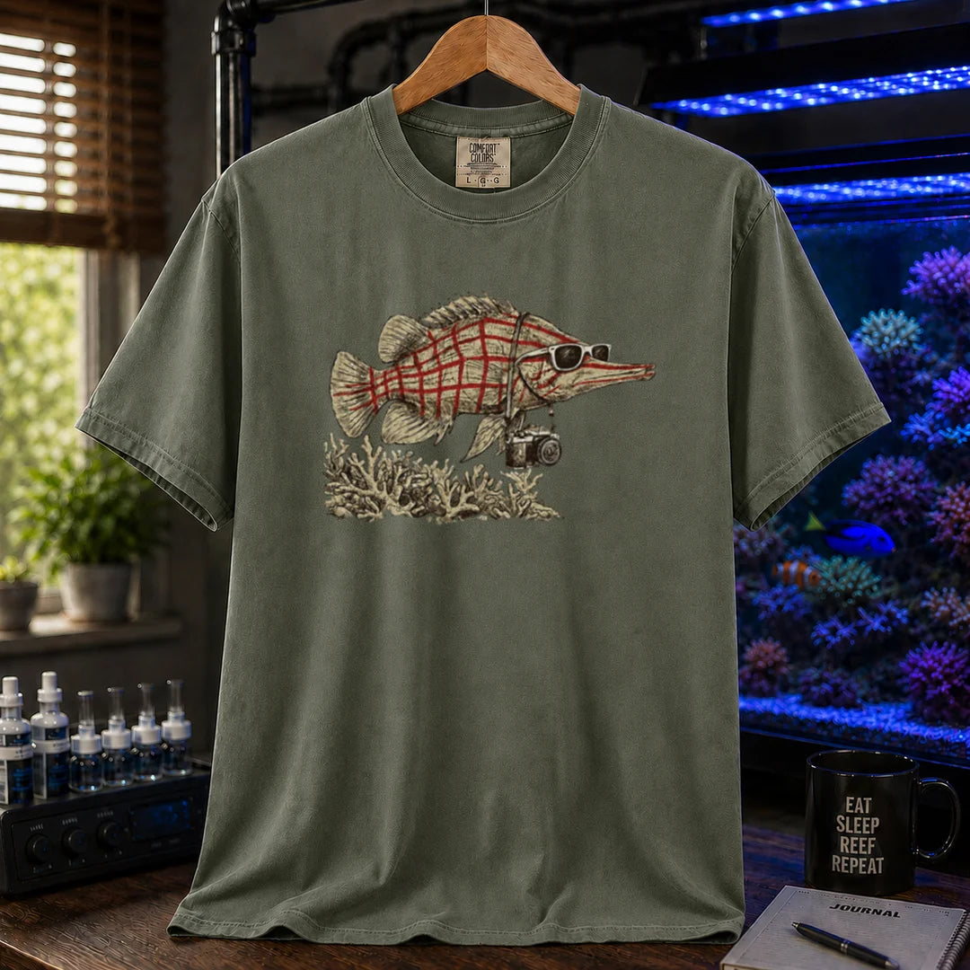 Saltwater aquarium graphic t-shirt featuring a vintage illustration of a Longnose Hawkfish wearing sunglasses and a camera over a coral reef, military green crew neck tee