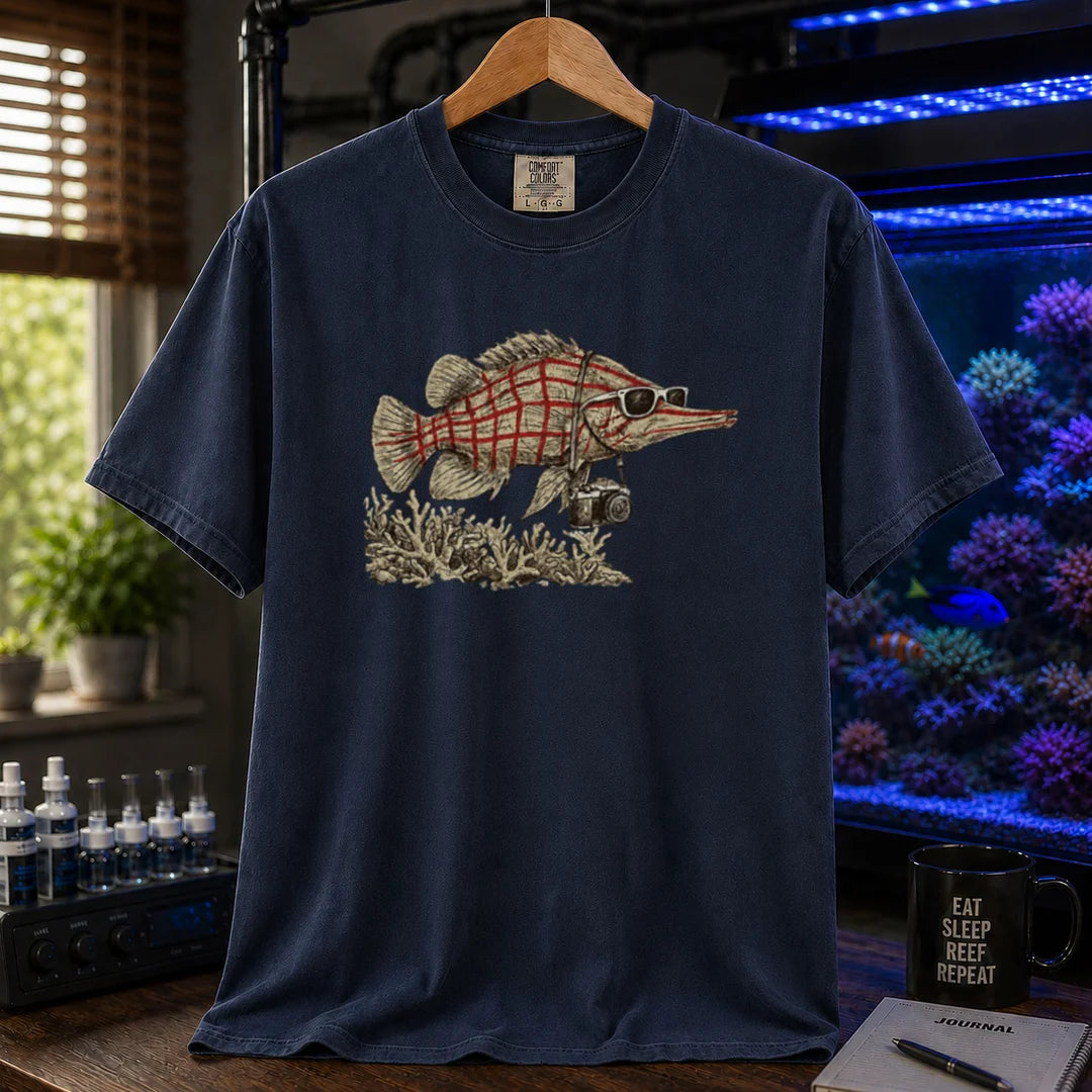 Saltwater aquarium graphic t-shirt featuring a vintage illustration of a Longnose Hawkfish wearing sunglasses and a camera over a coral reef, navy crew neck tee