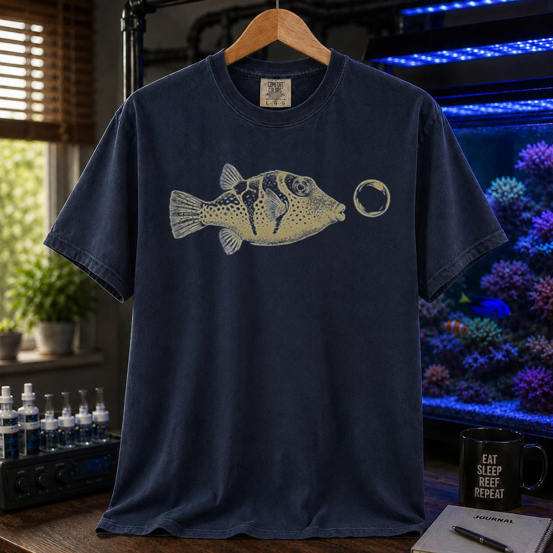 Saltwater aquarium graphic t-shirt featuring a vintage illustration of a Valentini Puffer blowing a bubble, navy crew neck tee