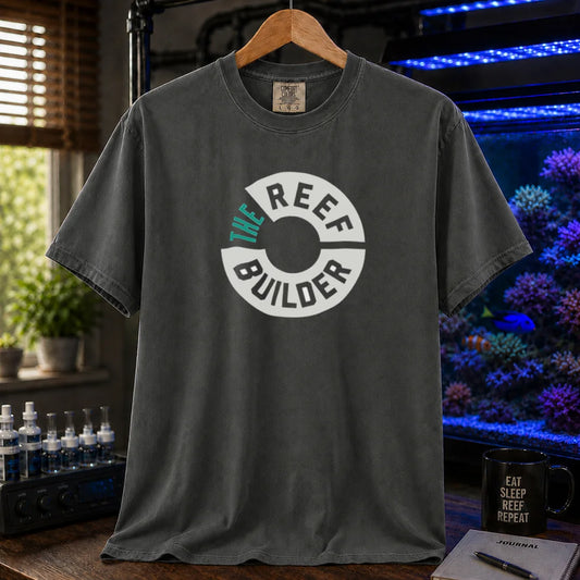 Saltwater aquarium graphic t-shirt featuring a circular badge with teal and white text reading: THE REEF BUILDER, khaki crew neck tee