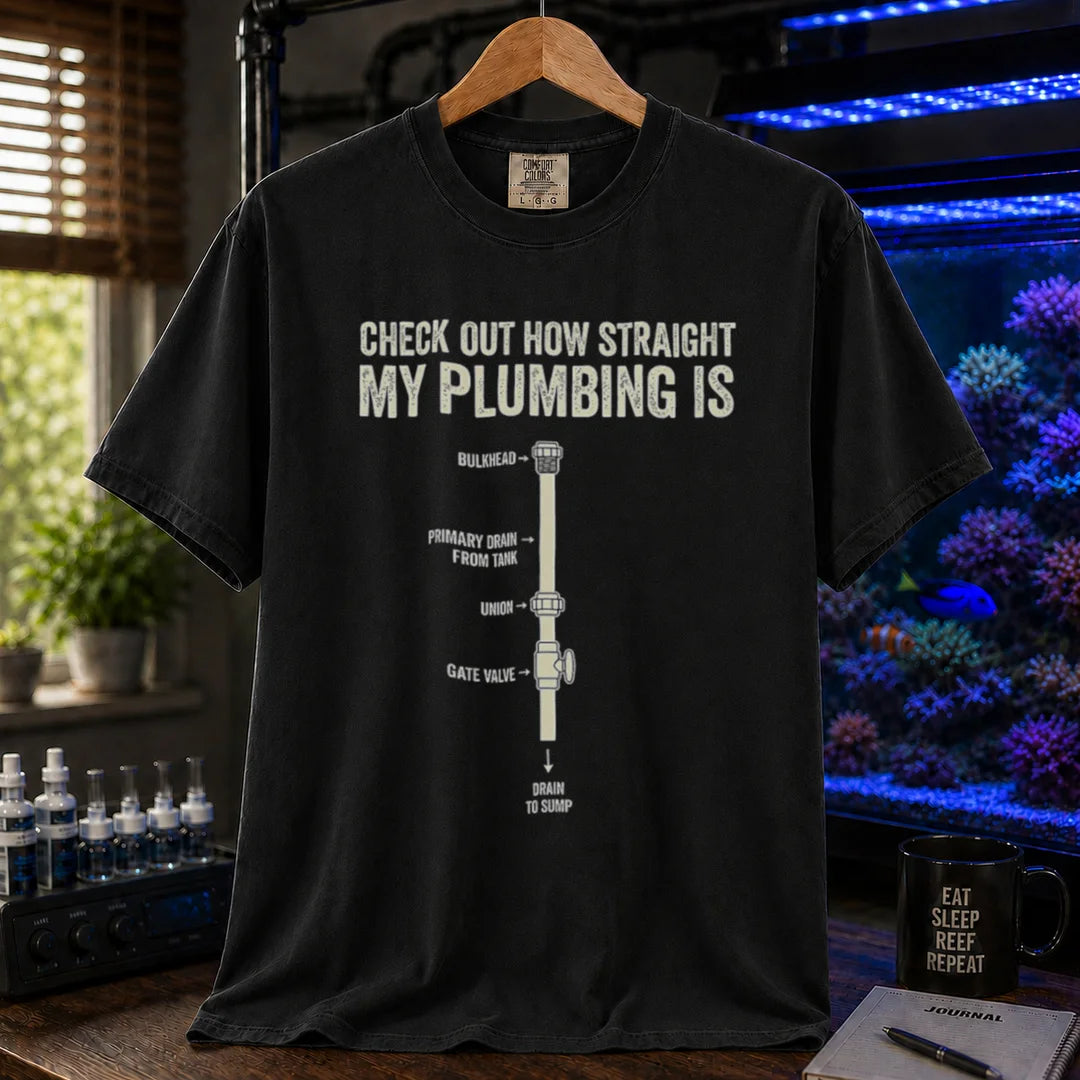 Saltwater aquarium graphic t-shirt featuring a technical plumbing schematic with labeled parts and text: CHECK OUT HOW STRAIGHT MY PLUMBING IS, black crew neck tee