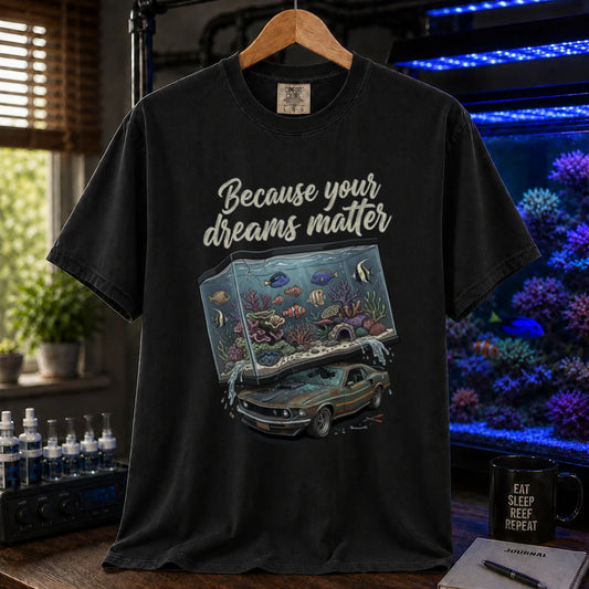 Saltwater aquarium graphic t-shirt featuring a massive reef tank crushing a classic car with text: Because your dreams matter, black crew neck tee