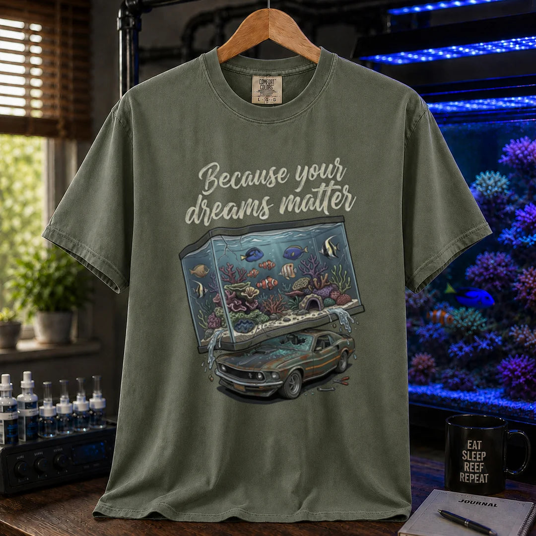 Saltwater aquarium graphic t-shirt featuring a massive reef tank crushing a classic car with text: Because your dreams matter, military green crew neck tee