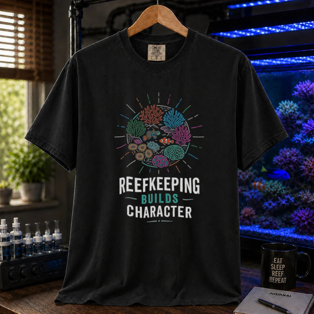 Saltwater aquarium graphic t-shirt featuring a colorful coral reef globe illustration and text: REEFKEEPING BUILDS CHARACTER, black crew neck tee