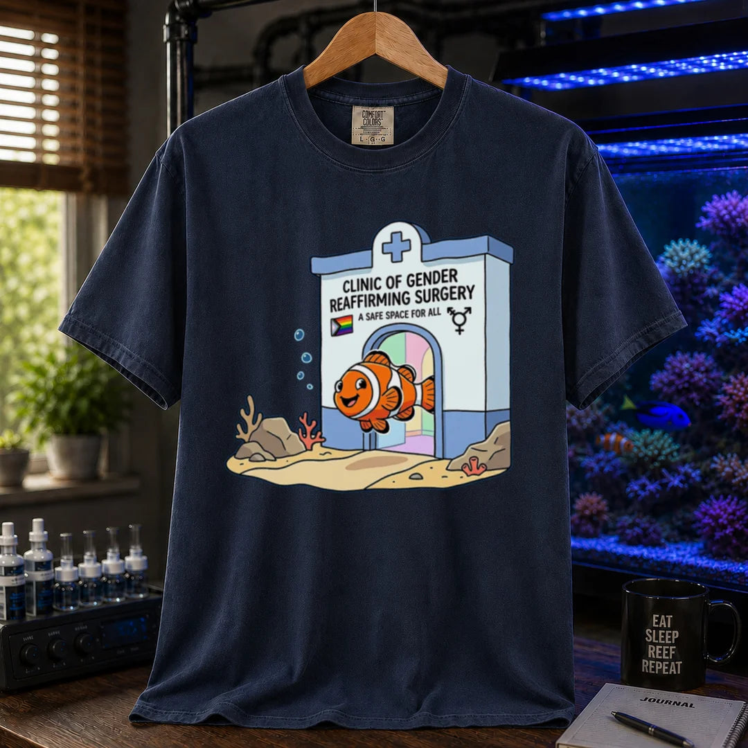 Saltwater aquarium graphic t-shirt featuring a clownfish coming out of a clinic for gender-affirming surgery, navy crew neck tee