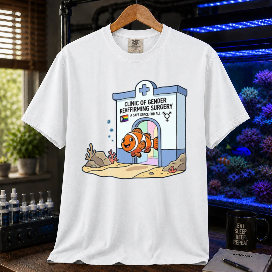 Saltwater aquarium graphic t-shirt featuring a clownfish coming out of a clinic for gender-affirming surgery, white crew neck tee