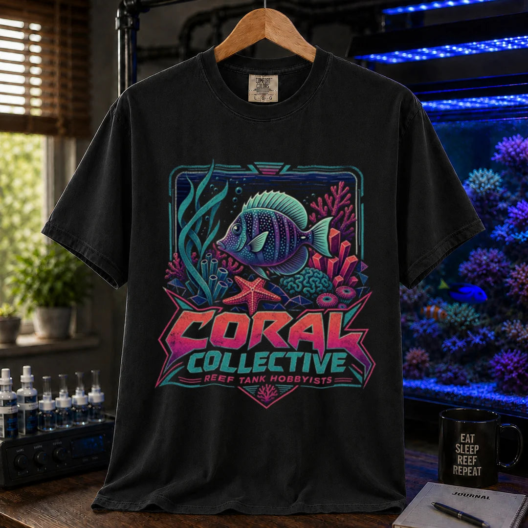 Saltwater aquarium graphic t-shirt featuring a vibrant retro-styled coral reef illustration and text: CORAL COLLECTIVE REEF TANK HOBBYISTS, black crew neck tee