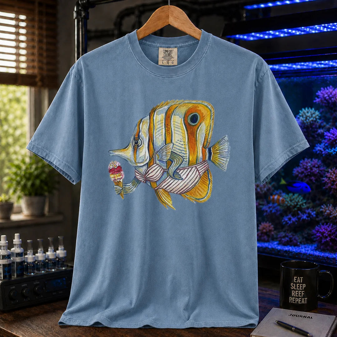 Saltwater aquarium graphic t-shirt featuring a humorous painted illustration of a Copperband Butterflyfish in a bikini holding an ice cream, blue crew neck tee