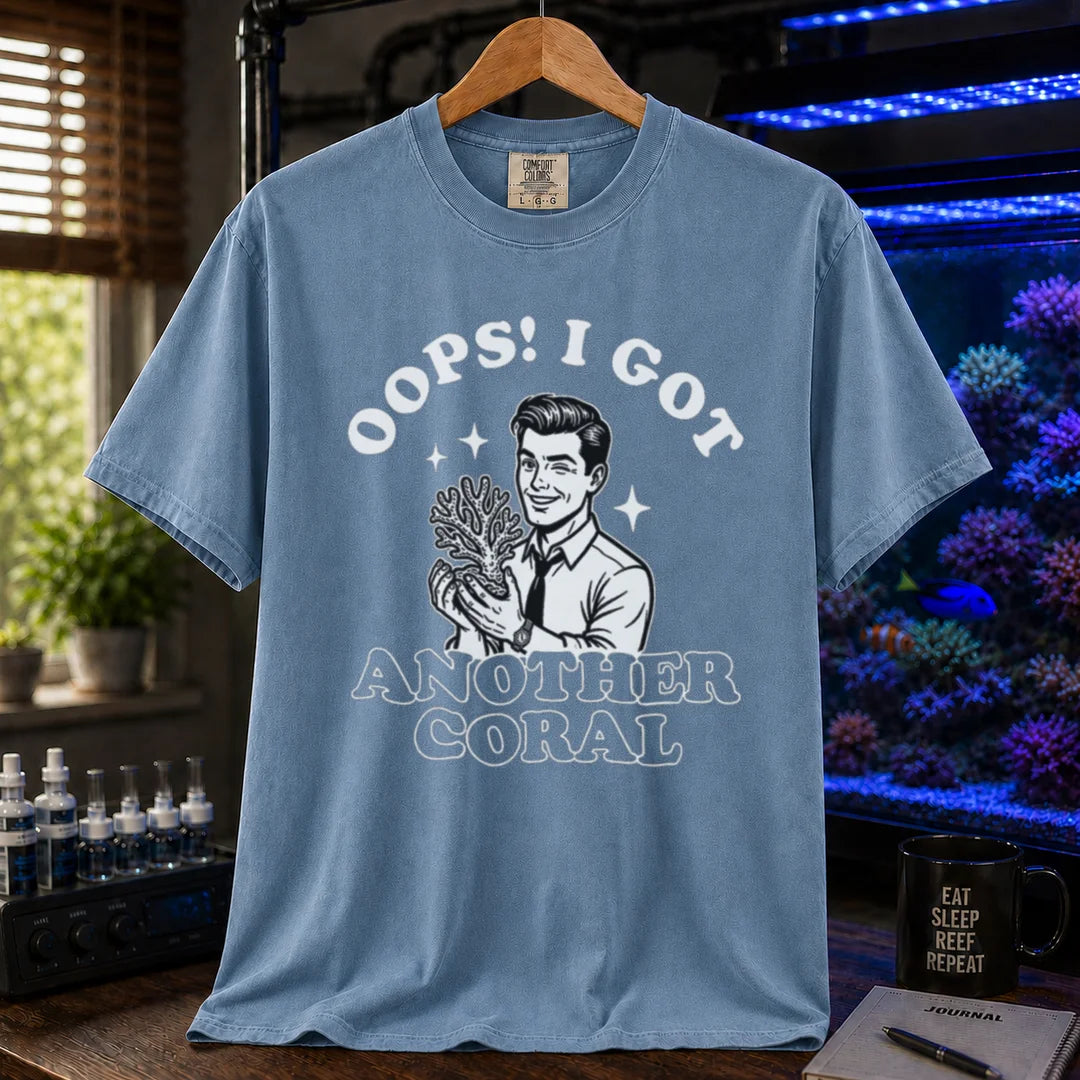 Saltwater aquarium graphic t-shirt featuring a retro illustration of a man holding a coral with text: OOPS! I GOT ANOTHER CORAL, blue crew neck tee