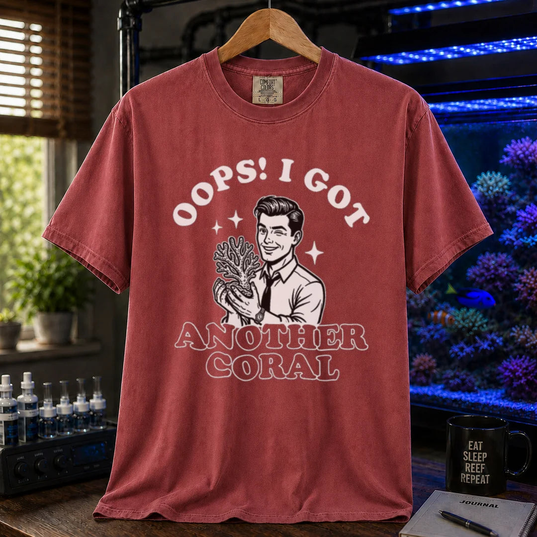Saltwater aquarium graphic t-shirt featuring a retro illustration of a man holding a coral with text: OOPS! I GOT ANOTHER CORAL, maroon crew neck tee