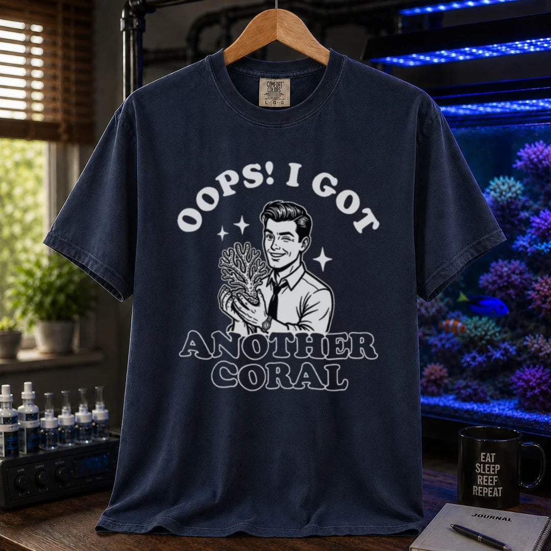 Saltwater aquarium graphic t-shirt featuring a retro illustration of a man holding a coral with text: OOPS! I GOT ANOTHER CORAL, navy crew neck tee
