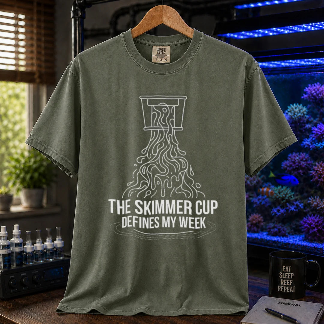 Saltwater aquarium graphic t-shirt featuring a line art illustration of a protein skimmer cup with text: THE SKIMMER CUP DEFINES MY WEEK, military green crew neck tee
