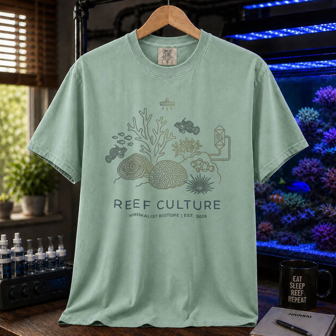 Saltwater aquarium graphic t-shirt featuring a minimalist line-art biotope illustration and text: REEF CULTURE MINIMALIST BIOTOPE | EST. 2026, green crew neck tee