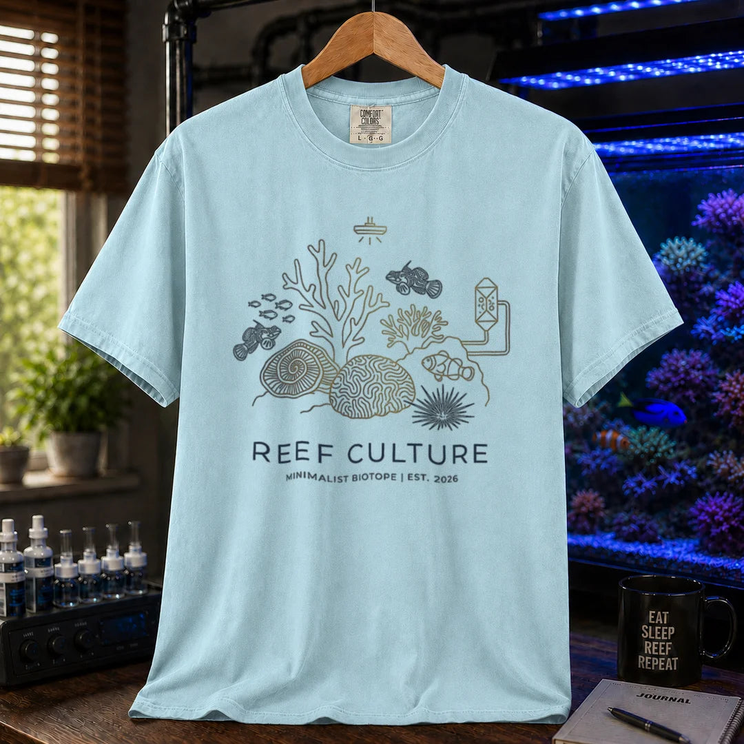 Saltwater aquarium graphic t-shirt featuring a minimalist line-art biotope illustration and text: REEF CULTURE MINIMALIST BIOTOPE | EST. 2026, light blue crew neck tee