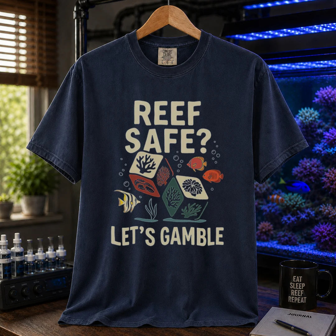 Saltwater aquarium graphic t-shirt featuring coral dice and fish illustrations with text: REEF SAFE? LET'S GAMBLE, navy crew neck tee