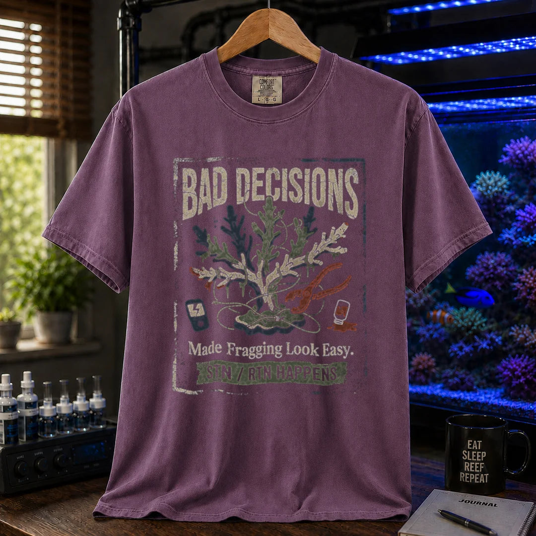 Saltwater aquarium graphic t-shirt featuring a distressed fragging illustration with tools and text: BAD DECISIONS Made Fragging Look Easy. STN / RTN HAPPENS, purple crew neck tee