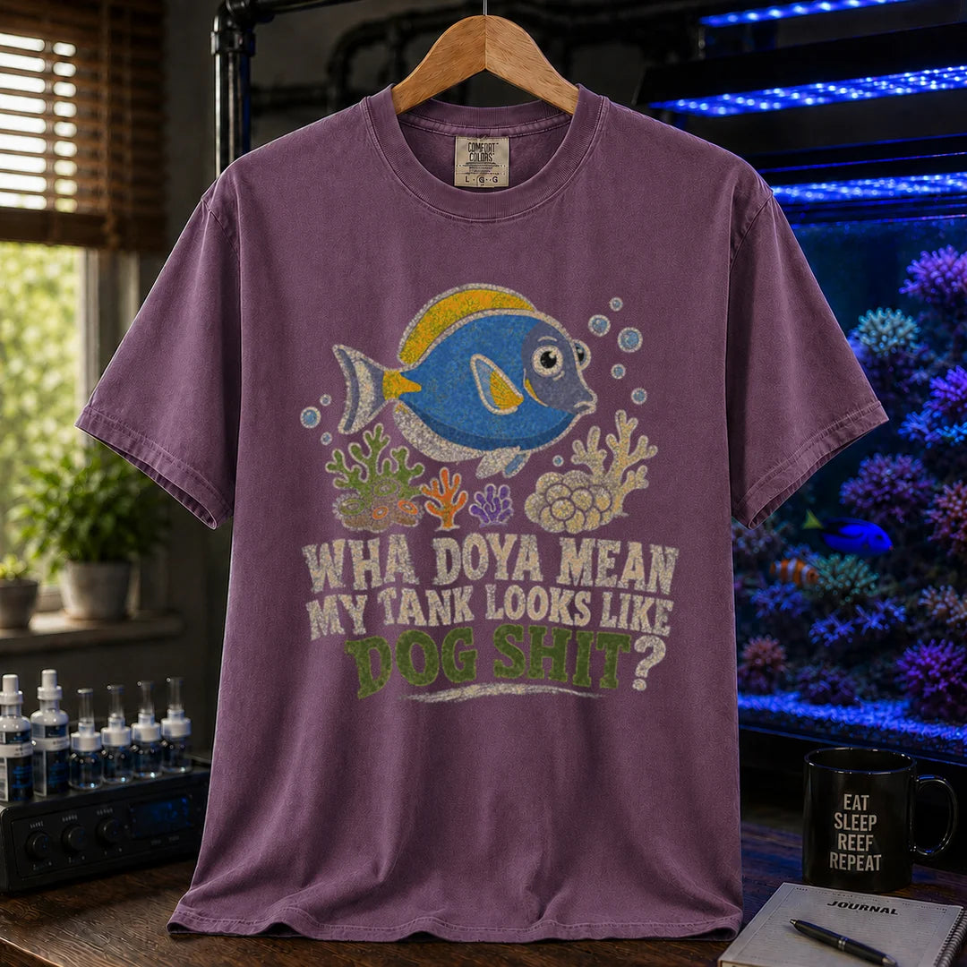 Saltwater aquarium graphic t-shirt featuring a blue tang illustration and text: WHA DOYA MEAN MY TANK LOOKS LIKE DOG SHIT?, purple crew neck tee