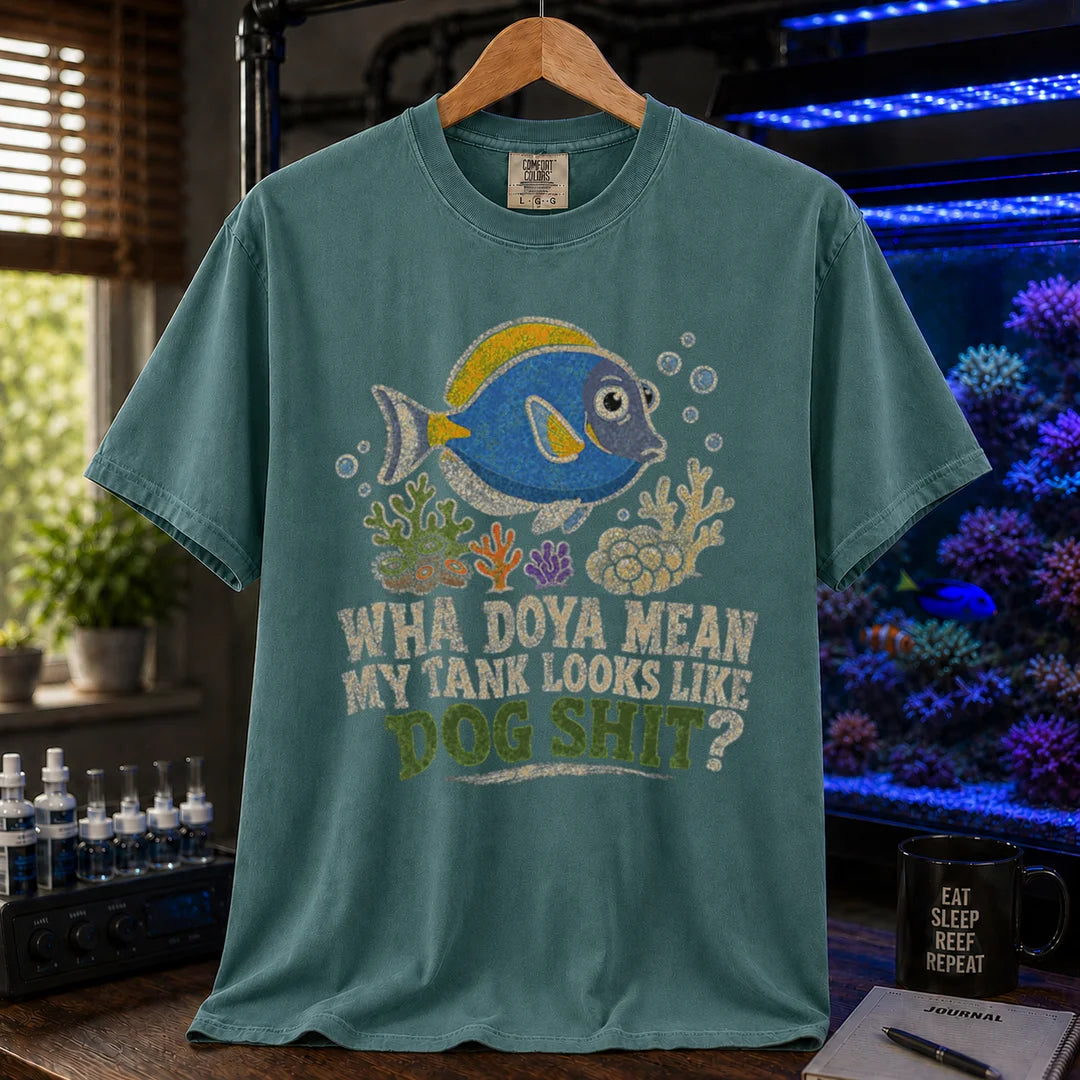 Saltwater aquarium graphic t-shirt featuring a blue tang illustration and text: WHA DOYA MEAN MY TANK LOOKS LIKE DOG SHIT?, green crew neck tee