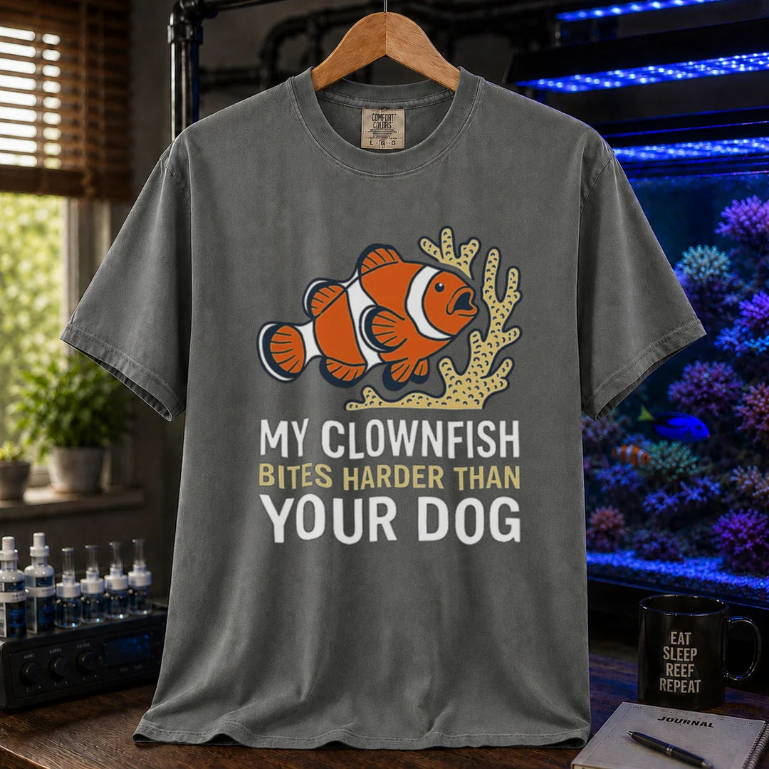 Saltwater aquarium graphic t-shirt featuring a clownfish and coral illustration with text: MY CLOWNFISH BITES HARDER THAN YOUR DOG, grey crew neck tee