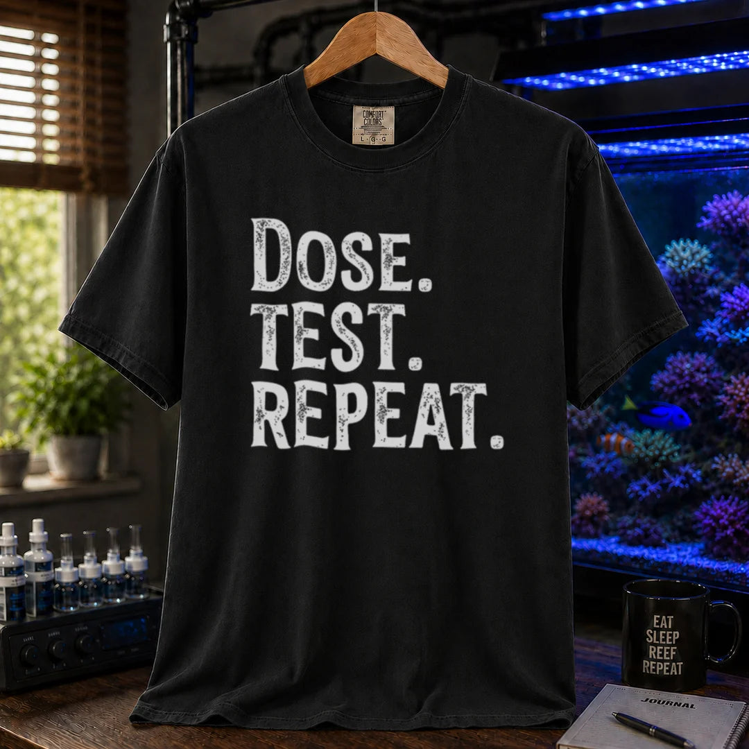 Saltwater aquarium graphic t-shirt featuring bold distressed text: DOSE. TEST. REPEAT., black crew neck tee