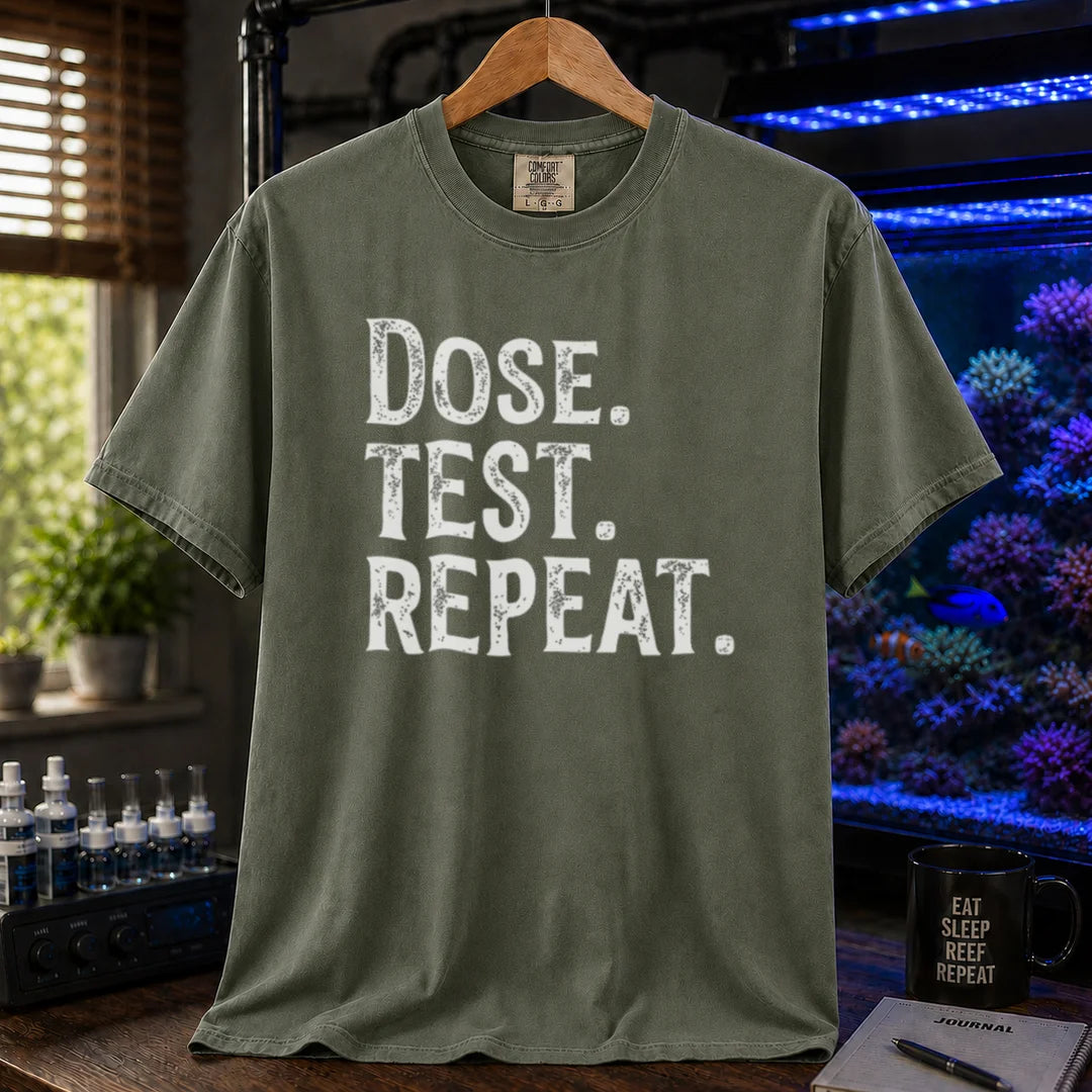 Saltwater aquarium graphic t-shirt featuring bold distressed text: DOSE. TEST. REPEAT., military green crew neck tee