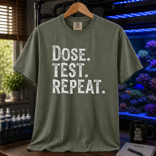Saltwater aquarium graphic t-shirt featuring bold distressed text: DOSE. TEST. REPEAT., military green crew neck tee