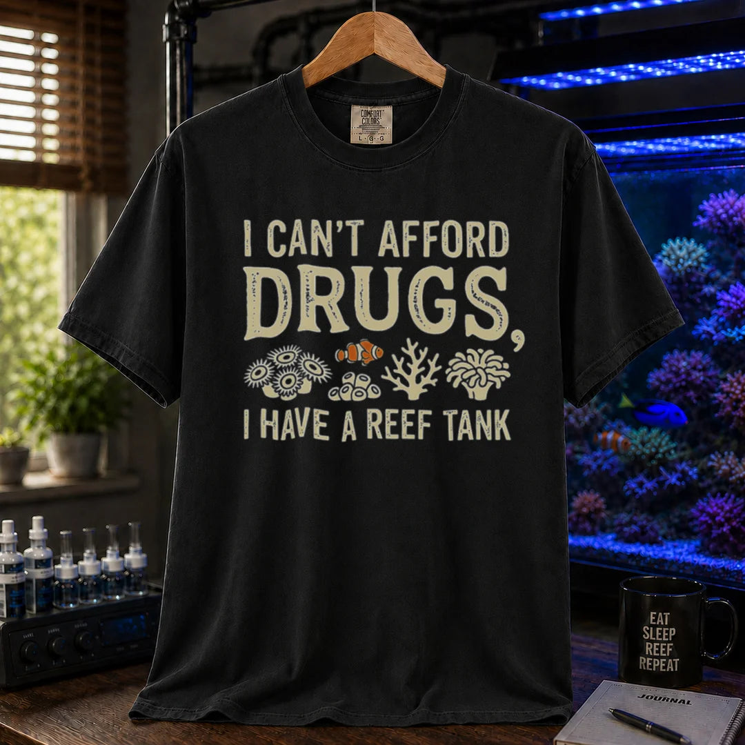 Saltwater aquarium graphic t-shirt featuring coral illustrations and text: I CAN'T AFFORD DRUGS, I HAVE A REEF TANK, black crew neck tee
