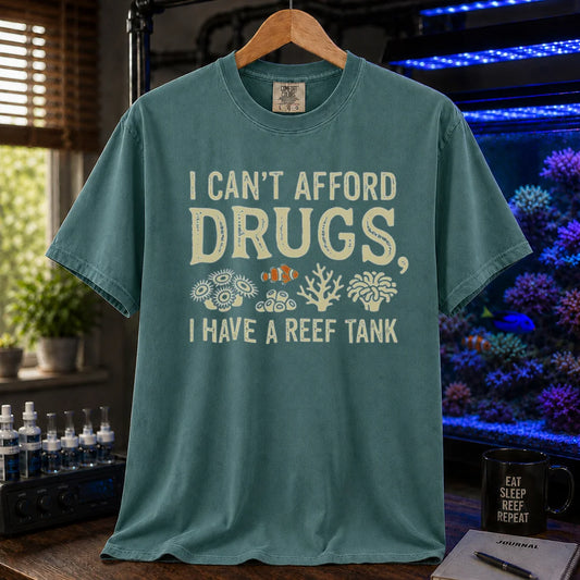 Saltwater aquarium graphic t-shirt featuring coral illustrations and text: I CAN'T AFFORD DRUGS, I HAVE A REEF TANK, green crew neck tee