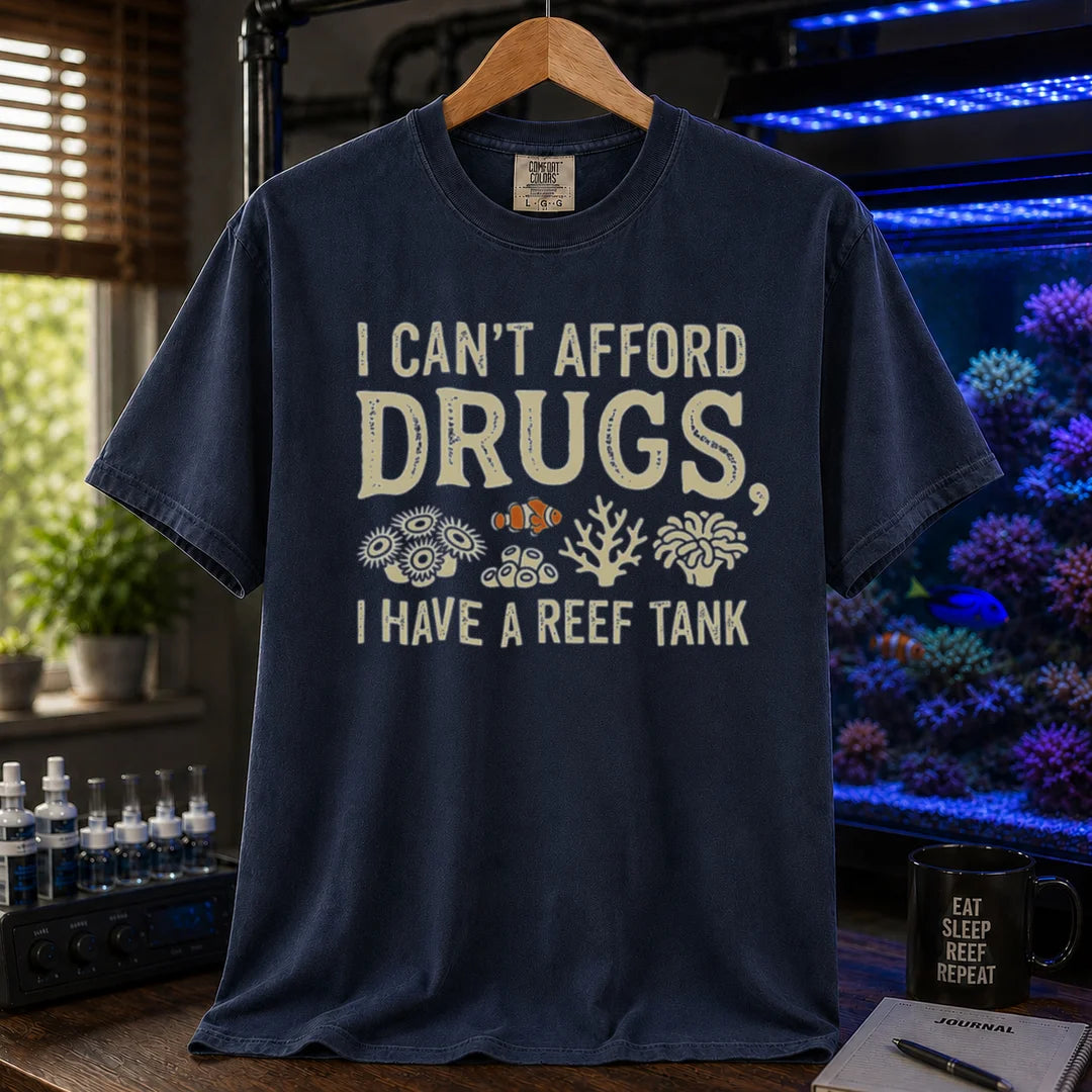 Saltwater aquarium graphic t-shirt featuring coral illustrations and text: I CAN'T AFFORD DRUGS, I HAVE A REEF TANK, navy crew neck tee