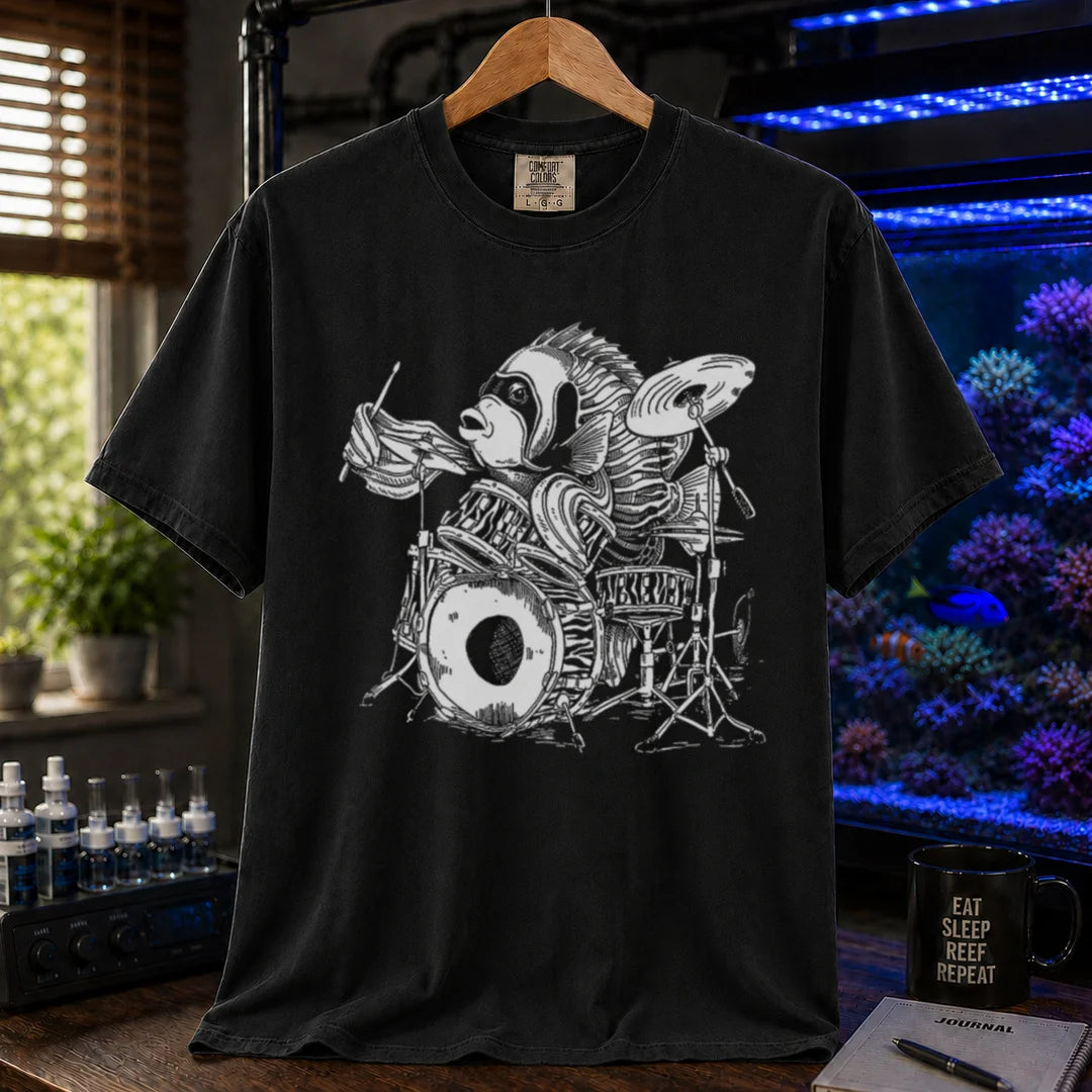 Saltwater aquarium graphic t-shirt featuring a detailed illustration of a spotted drum fish playing a drum kit, black crew neck tee