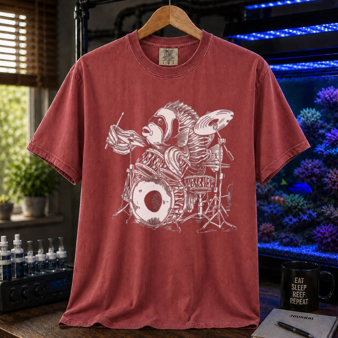 Saltwater aquarium graphic t-shirt featuring a detailed illustration of a spotted drum fish playing a drum kit, maroon, red crew neck tee