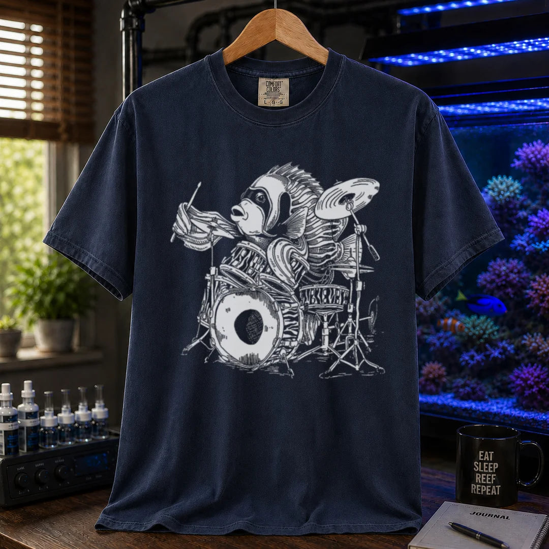 Saltwater aquarium graphic t-shirt featuring a detailed illustration of a spotted drum fish playing a drum kit, navy crew neck tee