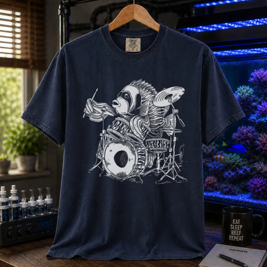 Saltwater aquarium graphic t-shirt featuring a detailed illustration of a spotted drum fish playing a drum kit, navy crew neck tee