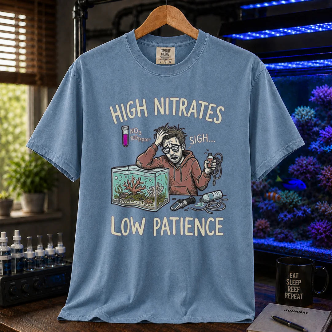 Saltwater aquarium graphic t-shirt featuring a stressed aquarist illustration and text: HIGH NITRATES LOW PATIENCE, blue crew neck tee