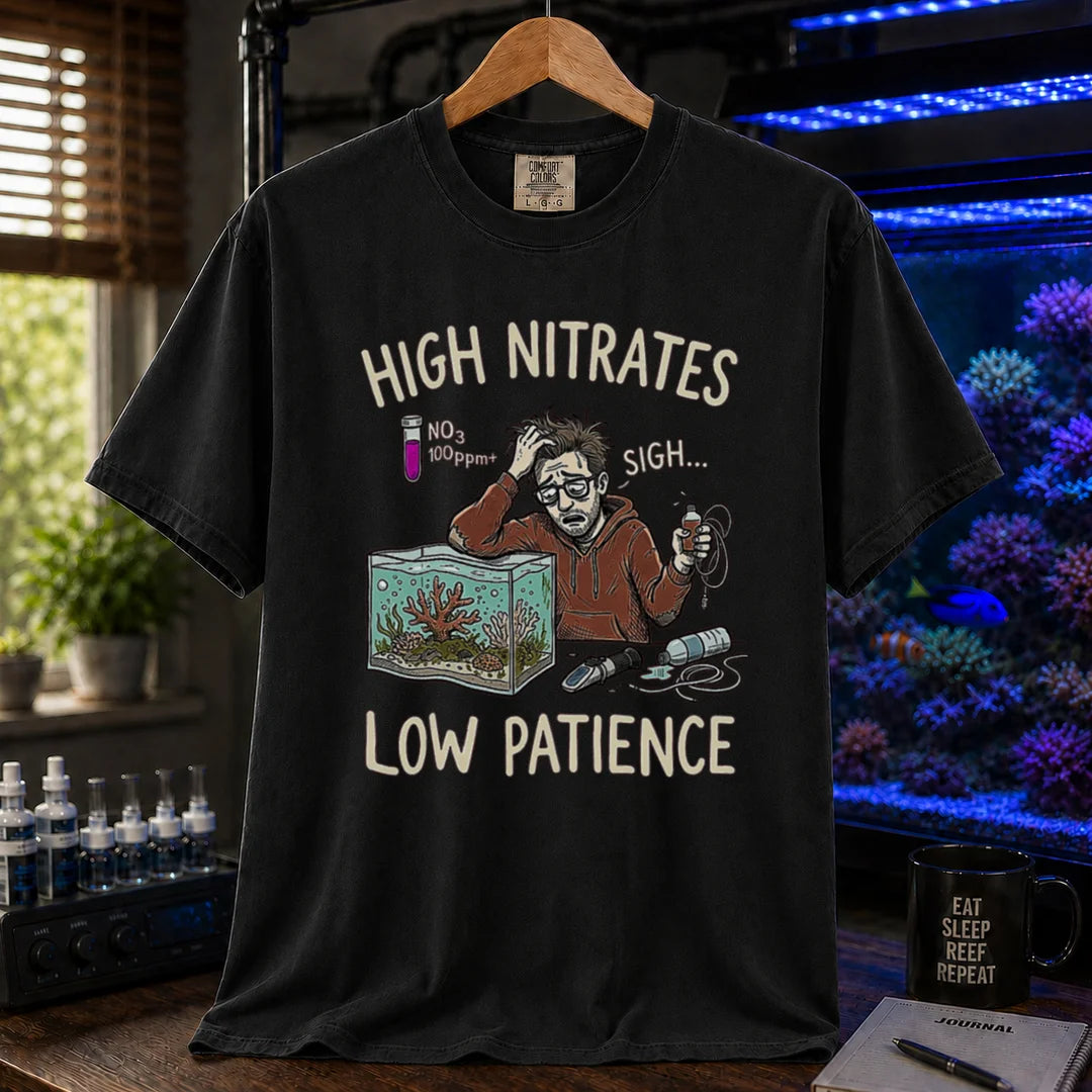 Saltwater aquarium graphic t-shirt featuring a stressed aquarist illustration and text: HIGH NITRATES LOW PATIENCE, black crew neck tee