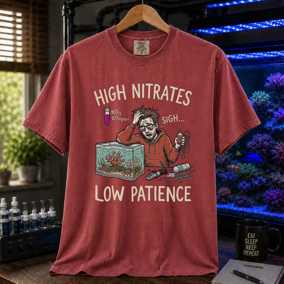 Saltwater aquarium graphic t-shirt featuring a stressed aquarist illustration and text: HIGH NITRATES LOW PATIENCE, maroon, red crew neck tee