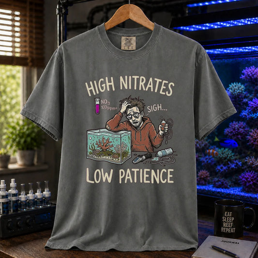 Saltwater aquarium graphic t-shirt featuring a stressed aquarist illustration and text: HIGH NITRATES LOW PATIENCE, grey crew neck tee