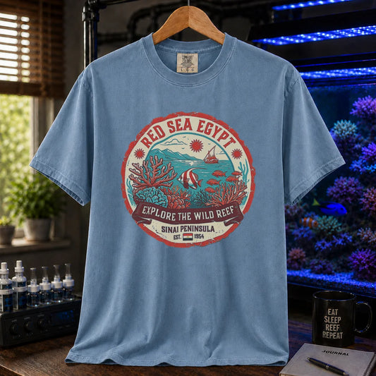 Saltwater aquarium graphic t-shirt featuring a vintage Red Sea Egypt circular emblem and text: RED SEA EGYPT EXPLORE THE WILD REEF, blue crew neck tee