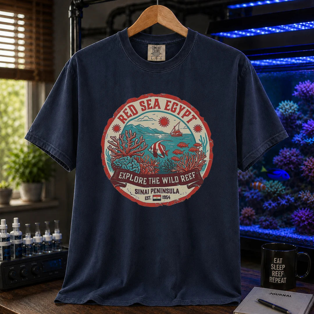 Saltwater aquarium graphic t-shirt featuring a vintage Red Sea Egypt circular emblem and text: RED SEA EGYPT EXPLORE THE WILD REEF, navy crew neck tee