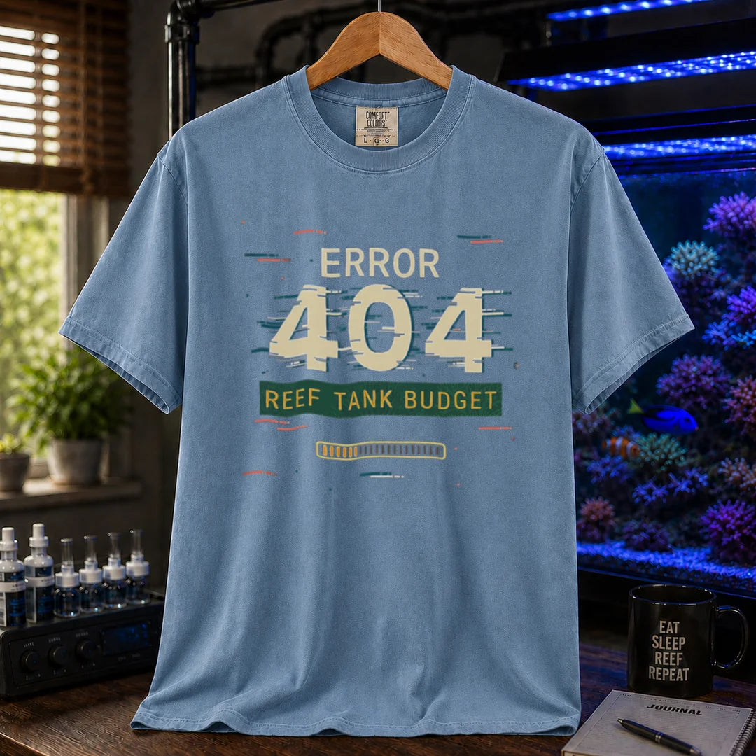 Saltwater aquarium graphic t-shirt featuring a digital glitch effect and text: ERROR 404 REEF TANK BUDGET, blue crew neck tee