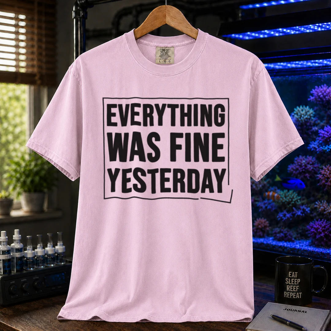 Saltwater aquarium graphic t-shirt featuring framed bold text: EVERYTHING WAS FINE YESTERDAY, pink crew neck tee