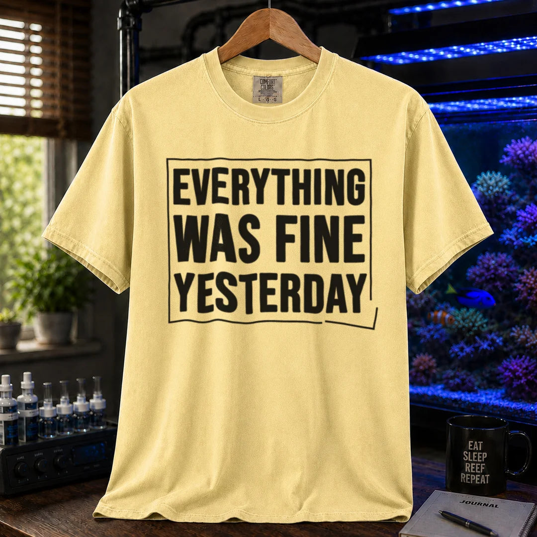 Saltwater aquarium graphic t-shirt featuring framed bold text: EVERYTHING WAS FINE YESTERDAY, yellow crew neck tee