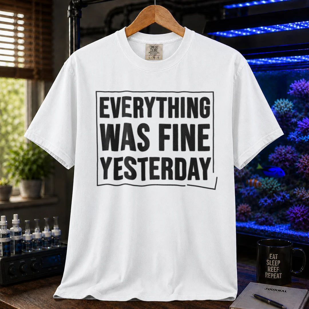 Saltwater aquarium graphic t-shirt featuring framed bold text: EVERYTHING WAS FINE YESTERDAY, white crew neck tee