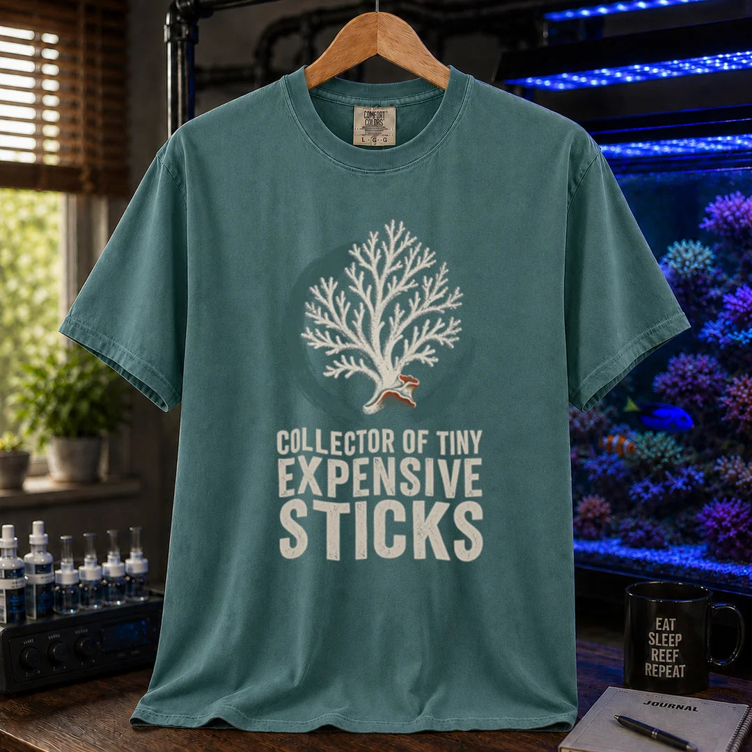 Saltwater aquarium graphic t-shirt featuring an SPS coral illustration and text: COLLECTOR OF TINY EXPENSIVE STICKS, green crew neck tee