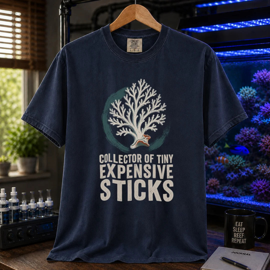 Saltwater aquarium graphic t-shirt featuring an SPS coral illustration and text: COLLECTOR OF TINY EXPENSIVE STICKS, navy crew neck tee