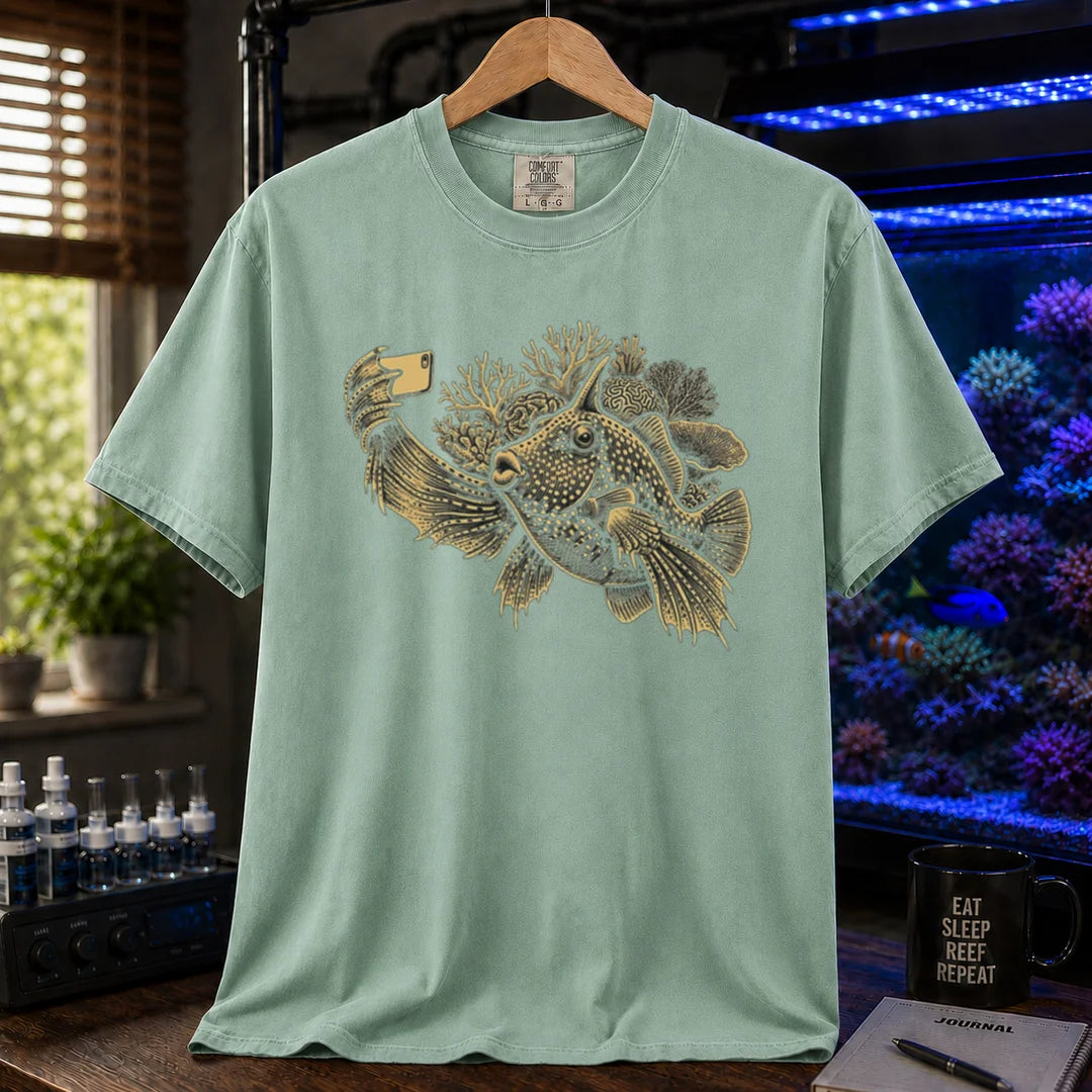 Saltwater aquarium graphic t-shirt featuring a fish taking a selfie illustration with corals, green crew neck tee