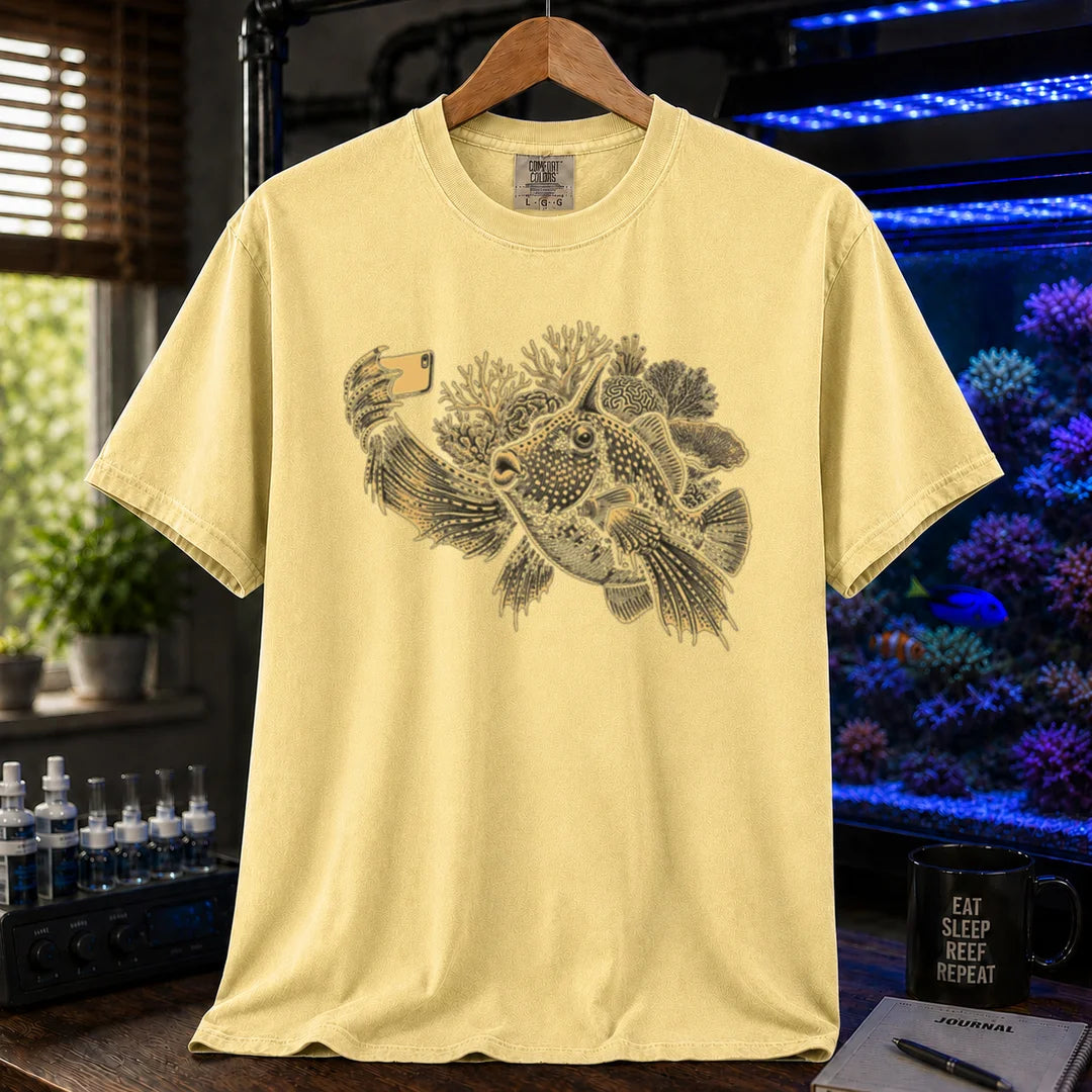Saltwater aquarium graphic t-shirt featuring a fish taking a selfie illustration with corals, yellow crew neck tee