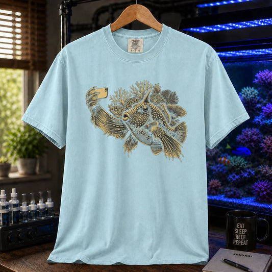 Saltwater aquarium graphic t-shirt featuring a fish taking a selfie illustration with corals, light blue crew neck tee