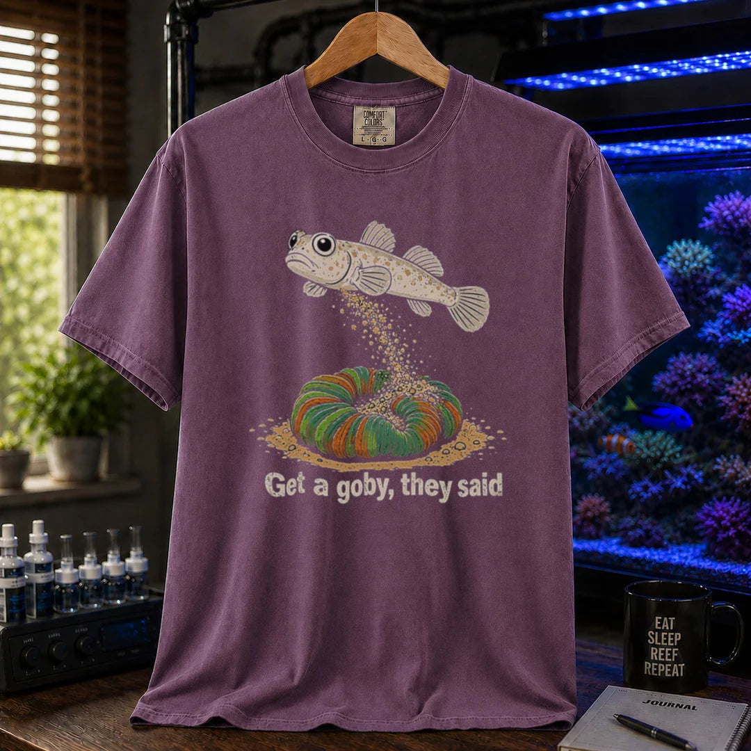 Saltwater aquarium graphic t-shirt featuring a goby dumping sand on a coral illustration and text: Get a goby, they said, purple crew neck tee