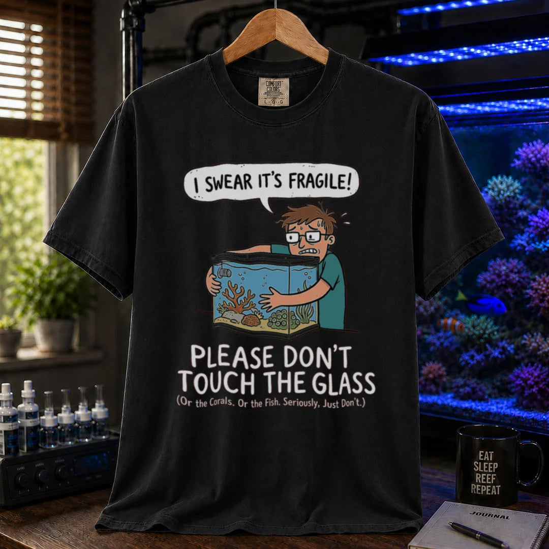 Saltwater aquarium graphic t-shirt featuring an anxious aquarist hugging a tank illustration and text: I SWEAR IT'S FRAGILE! PLEASE DON'T TOUCH THE GLASS, black crew neck tee